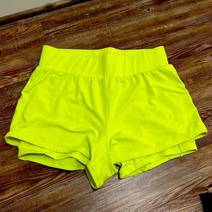 Fluorescent yellow running shorts. Size L